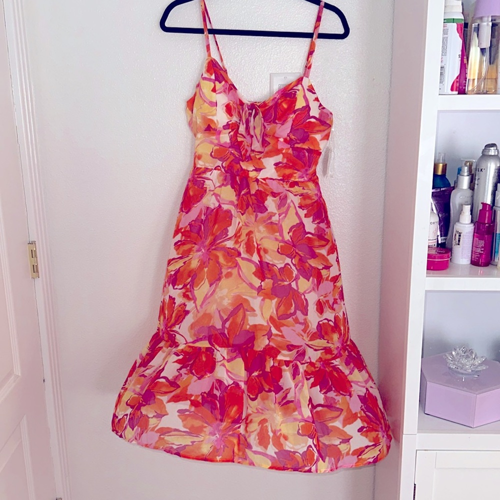 Very colorful, soft lightweight summer dress adjustable straps. The brand AUW